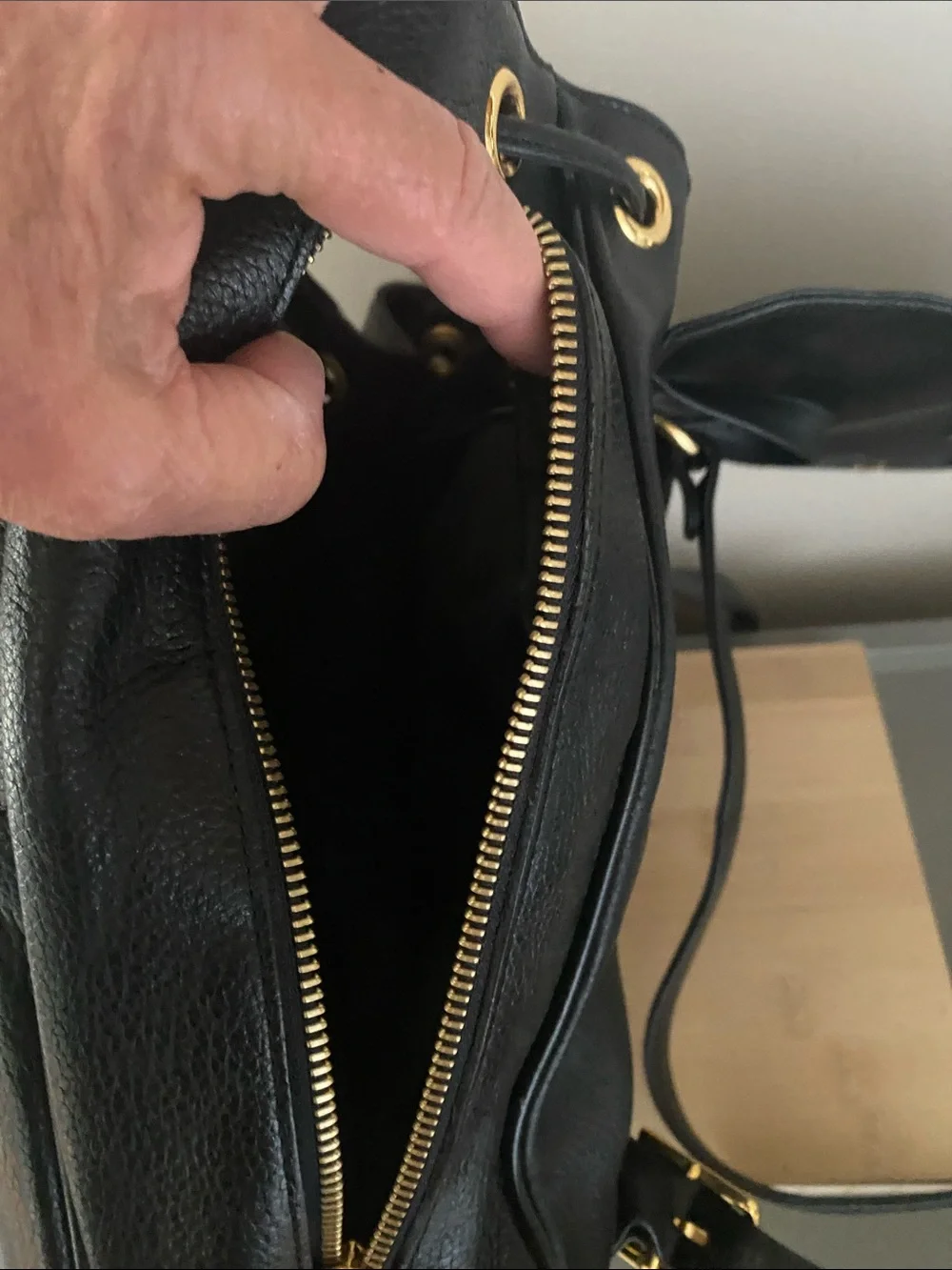 MCM Black Pebbled Leather Backpack with Gold Emblem Hardwarer